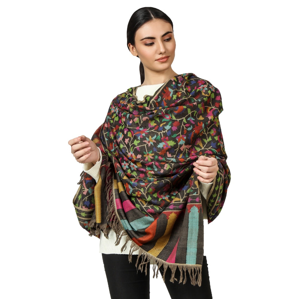 A woman wearing black kani shawl