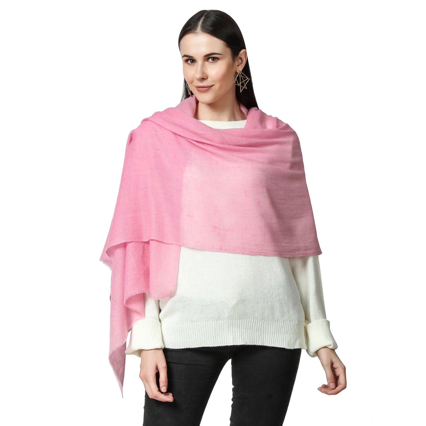 a Woman wearing a Pink Cashmere Scarf over her white sweater and Black jeans