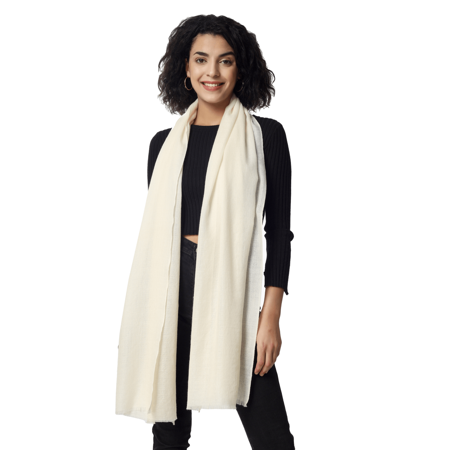 A woman wearing a Merino wool stole on a black Crop top and trousers