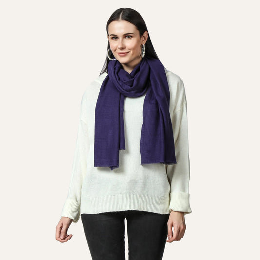 Navy blue cashmere scarf worn by a woman