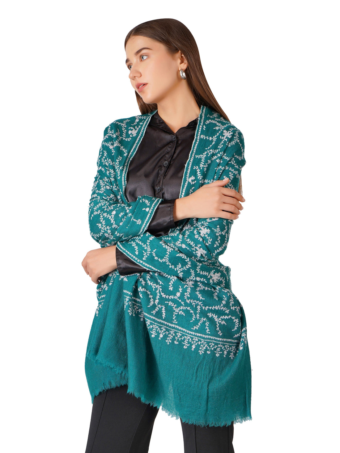 A woman wearing a Pashmina Shawl of Sea Green Color with White Sozni Embroidery over it