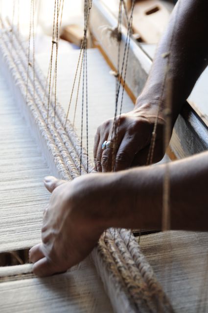 A Kashmiri Weaver weaving a high quality Cashmere scarf on a traditional wooden loom