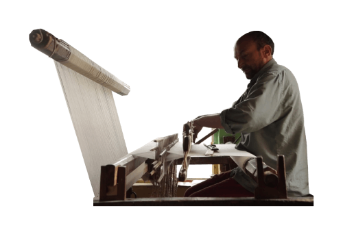 A Kashmiri Artisan weaving Cashmere Pashmina Scarf in the Srinagar city of Kashmir on a traditional wooden handloom