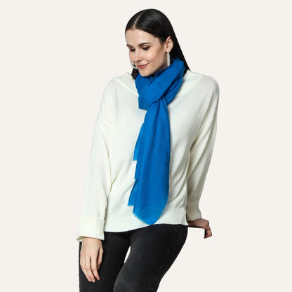 Woman wearing a blue cashmere scarf