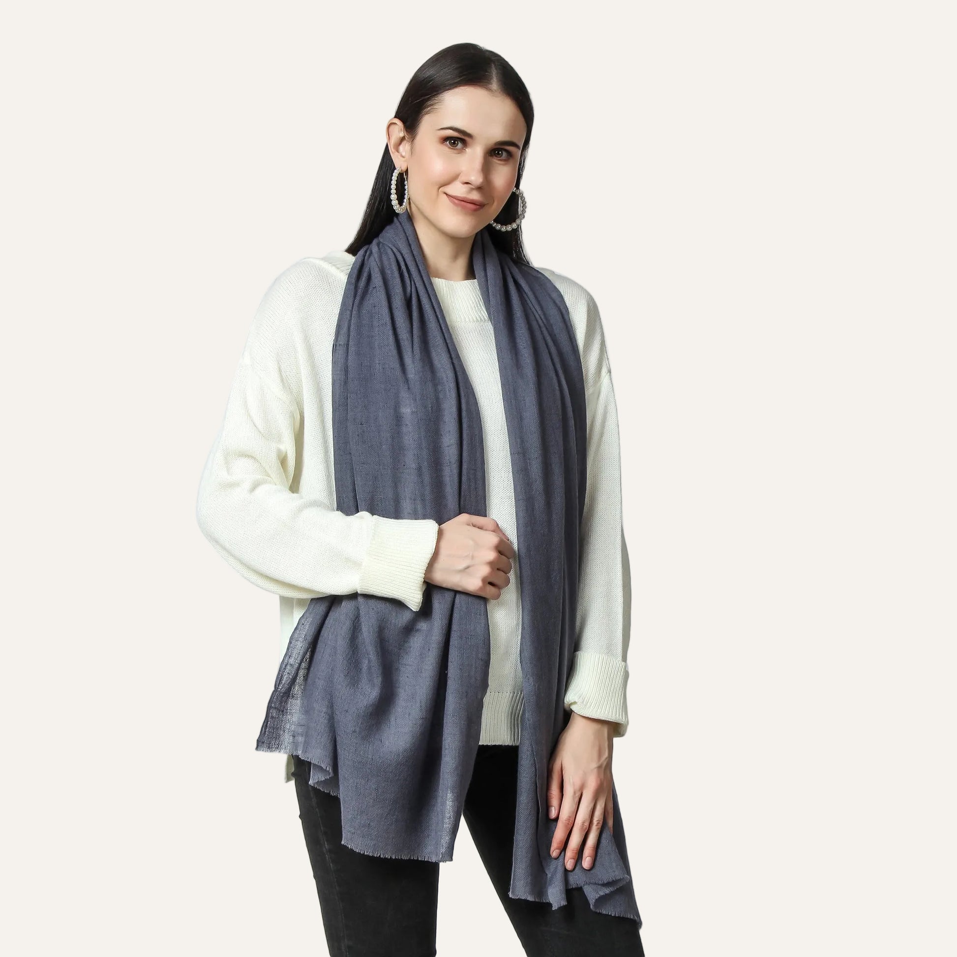 Gray cashmere scarf worn by a woman