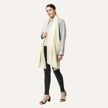 Woman wearing a light-colored scarf on a white background