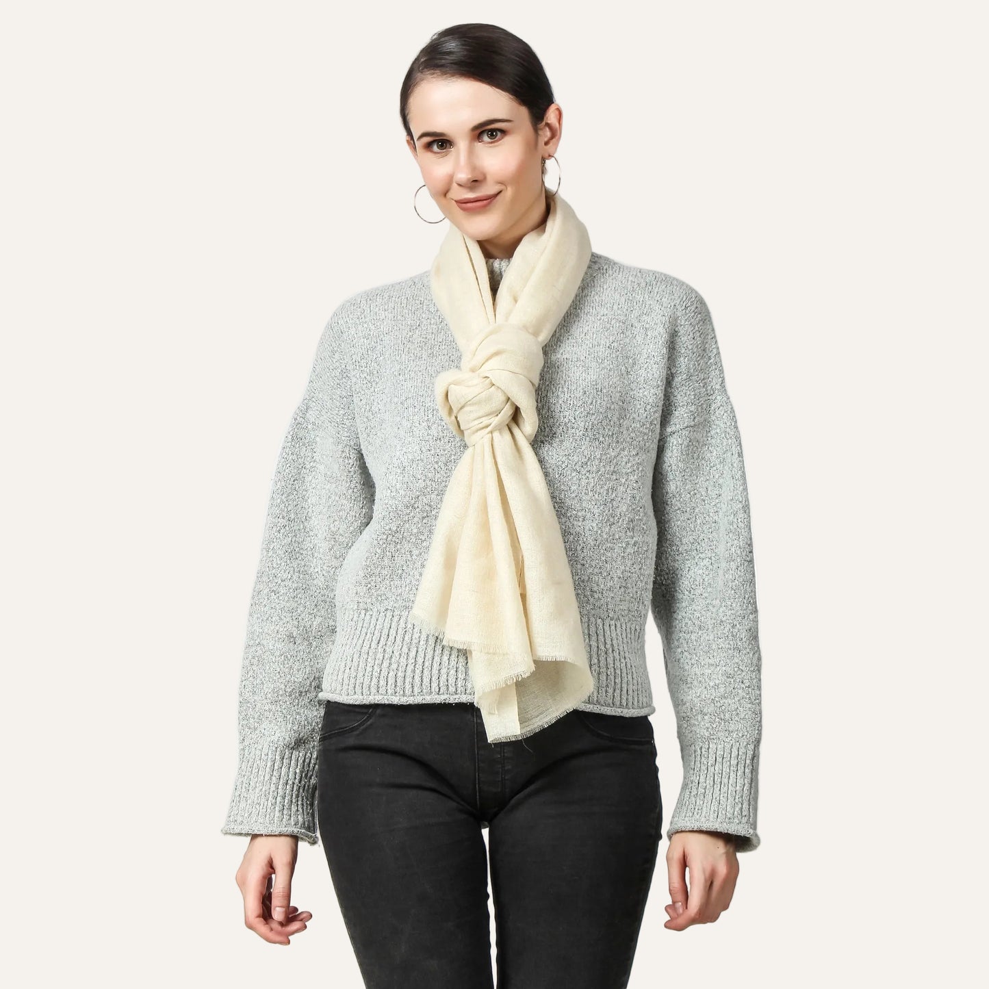 Off white cashmere scarf worn by a woman