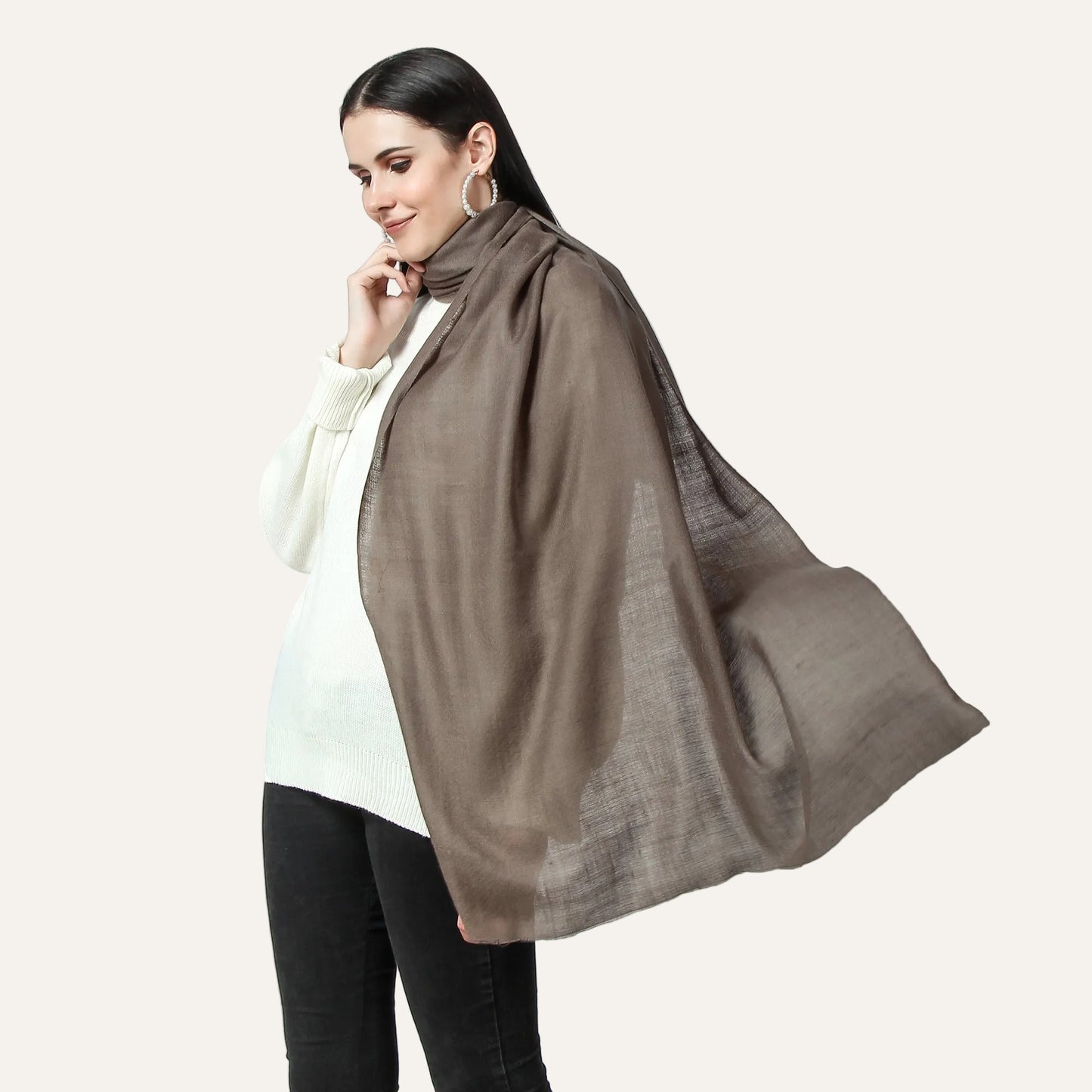 A woman wearing a cahsmere scarf