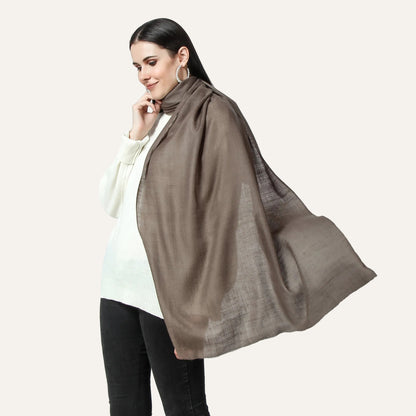 A woman wearing a cahsmere scarf