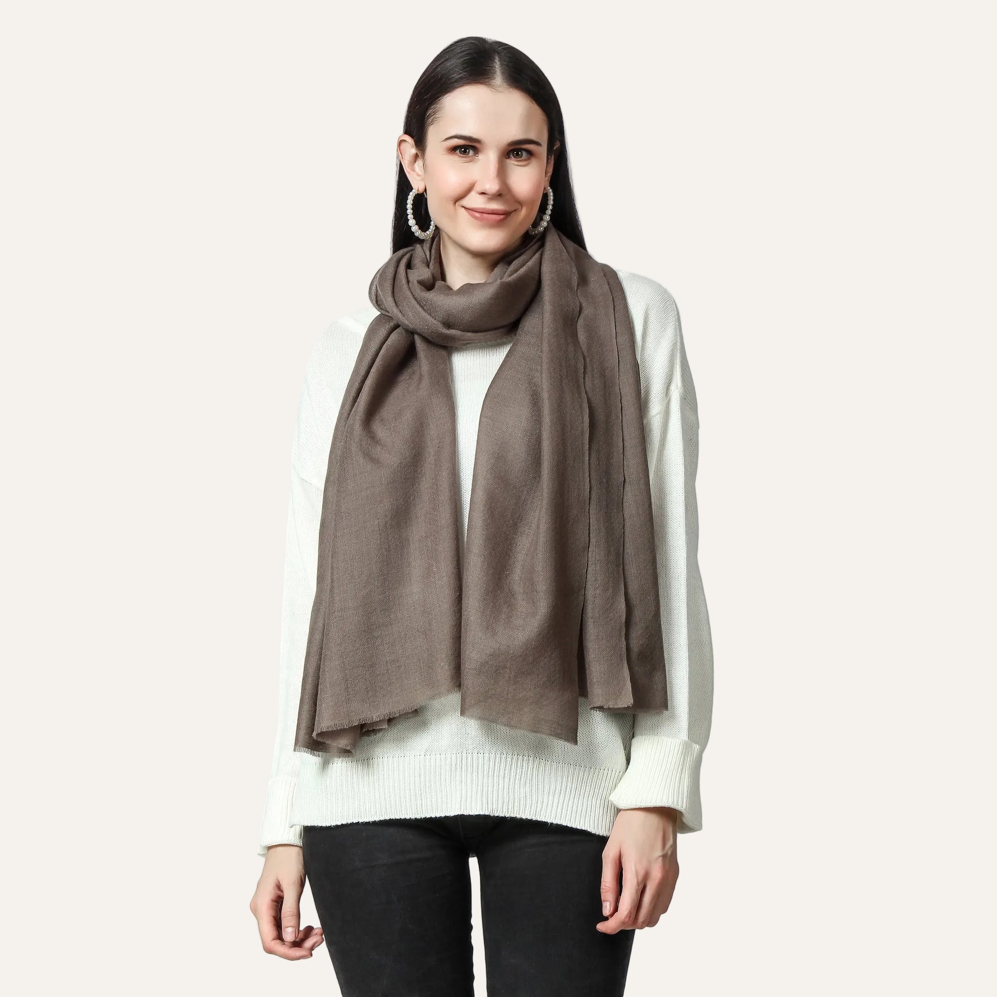 Woman wearing a merlin cashmere scarf