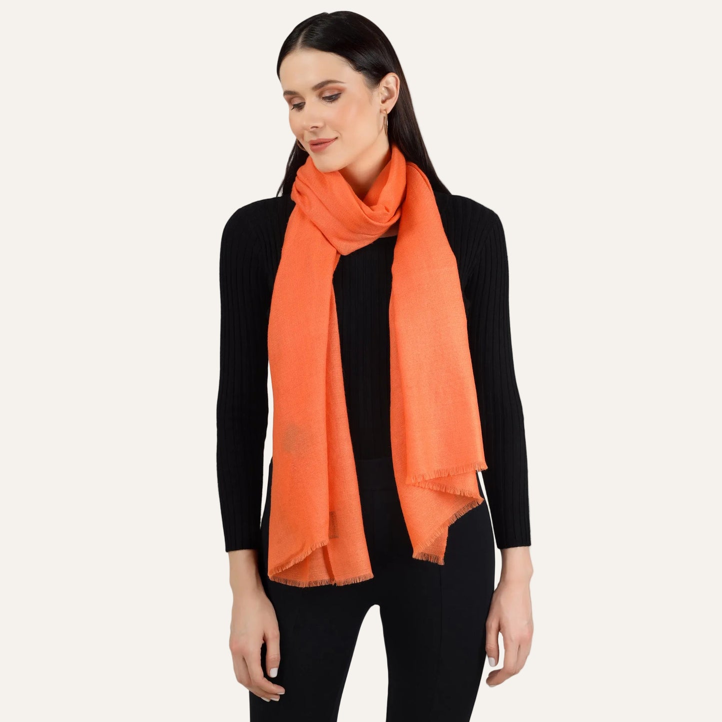orange scarf draped by woman around her neck