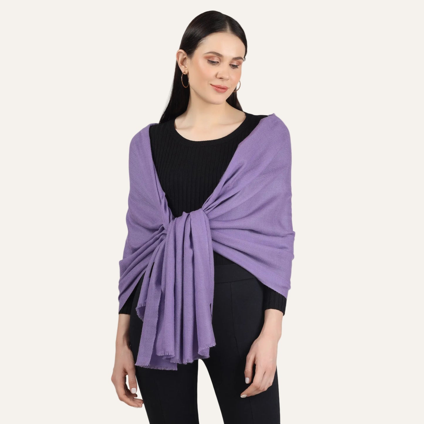 Womans cashmere scarf purple color worn by a woman over black sweater and black pants